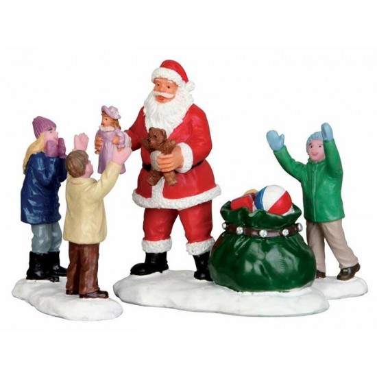Figurines Le Père Noël avec sa poche de cadeaux...